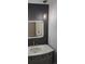 Modern bathroom featuring stylish vanity, backlit mirror, and elegant pendant lighting at 8897 Wagner Ln, Westminster, CO 80031