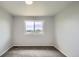 This spacious bedroom boasts neutral paint, new carpeting, and a bright window view at 8897 Wagner Ln, Westminster, CO 80031