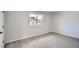 Neutral bedroom with window providing natural light and grey carpet at 8897 Wagner Ln, Westminster, CO 80031