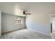Neutral bedroom featuring carpet, ceiling fan, and natural light from the window at 8897 Wagner Ln, Westminster, CO 80031