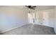 Spacious bedroom with neutral carpeting, ceiling fan, and ample closet space at 8897 Wagner Ln, Westminster, CO 80031