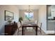 Formal dining room with a modern chandelier, and neutral decor at 8897 Wagner Ln, Westminster, CO 80031