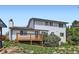Two-story home featuring a wood deck and a backyard at 8897 Wagner Ln, Westminster, CO 80031