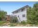 Two-story home with light blue siding and wood deck at 8897 Wagner Ln, Westminster, CO 80031