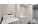 Updated laundry room with new machines and counter space at 8897 Wagner Ln, Westminster, CO 80031