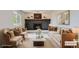 Cozy living room featuring a fireplace, plush seating, and elegant decor at 8897 Wagner Ln, Westminster, CO 80031