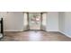 Bright living room with hardwood floors and large window with natural light at 8897 Wagner Ln, Westminster, CO 80031