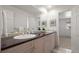 Bathroom featuring dual sinks, granite countertop, and a large mirror at 4862 Silver Sage Ct, Boulder, CO 80301