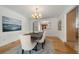 Inviting dining room featuring hardwood floors, neutral decor, and an elegant chandelier, ideal for entertaining guests at 4862 Silver Sage Ct, Boulder, CO 80301