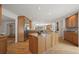 Spacious kitchen with stainless steel refrigerator, island, granite countertops and natural light at 4862 Silver Sage Ct, Boulder, CO 80301