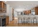 Open kitchen featuring a breakfast bar, modern appliances, and light wood cabinetry at 4862 Silver Sage Ct, Boulder, CO 80301