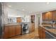 Bright kitchen with open concept to the living room, stainless steel appliances and granite counter tops at 4862 Silver Sage Ct, Boulder, CO 80301