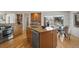 Spacious kitchen featuring modern appliances, a large island, and a view of the backyard at 4862 Silver Sage Ct, Boulder, CO 80301