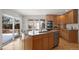 Kitchen with stainless steel appliances, kitchen island, eat in nook and lots of natural light at 4862 Silver Sage Ct, Boulder, CO 80301