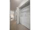 Bright laundry room with washer, dryer, and storage shelves at 4862 Silver Sage Ct, Boulder, CO 80301