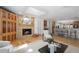 Cozy living room with fireplace, skylight, and open floor plan to the kitchen at 4862 Silver Sage Ct, Boulder, CO 80301