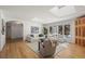 Bright living room with hardwood floors, skylights, fireplace, and large windows overlooking the yard at 4862 Silver Sage Ct, Boulder, CO 80301