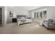 Spacious main bedroom featuring neutral decor, carpet flooring, and a large window for natural light at 4862 Silver Sage Ct, Boulder, CO 80301
