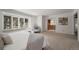 Serene main bedroom featuring neutral decor, large windows for natural light, and an ensuite bathroom entrance at 4862 Silver Sage Ct, Boulder, CO 80301