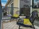 Balcony with outdoor seating, modern metal railings, and stylish decor overlooking the neighborhood at 1747 N Washington St # C306, Denver, CO 80203