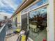 Balcony with outdoor seating, sliding glass door, and stylish decor overlooking the neighborhood at 1747 N Washington St # C306, Denver, CO 80203