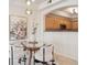 Cozy dining area showcasing modern light fixtures and an open view of the kitchen at 1747 N Washington St # C306, Denver, CO 80203