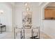 Elegant dining area featuring a modern chandelier and a stylish painting at 1747 N Washington St # C306, Denver, CO 80203
