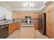 Well-lit kitchen with stainless steel appliances, an island, and marble backsplash at 1747 N Washington St # C306, Denver, CO 80203