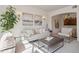 Comfortable living room with an open floor plan, natural light, and stylish decor at 1747 N Washington St # C306, Denver, CO 80203