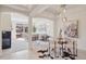 Bright living area featuring a fireplace, open floor plan, and access to an outdoor balcony at 1747 N Washington St # C306, Denver, CO 80203