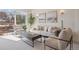 Sun-filled living room with comfortable seating, natural light, and modern décor at 1747 N Washington St # C306, Denver, CO 80203