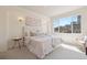 Bright bedroom with city views, cozy bedding, and elegant decor for comfortable living at 1747 N Washington St # C306, Denver, CO 80203