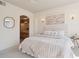 Cozy bedroom featuring neutral tones, plush bedding, and ensuite bathroom access for ultimate convenience at 1747 N Washington St # C306, Denver, CO 80203
