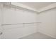 Walk-in closet featuring ample storage space with multiple rods and shelving for organization at 1747 N Washington St # C306, Denver, CO 80203