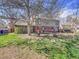 Spacious backyard featuring a large tree, deck, and well-maintained lawn, perfect for outdoor enjoyment at 3766 E Easter S Cir, Centennial, CO 80122