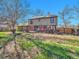 Spacious backyard with large patio, chairs, and a well-maintained lawn perfect for entertaining at 3766 E Easter S Cir, Centennial, CO 80122