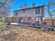 Backyard view with a dark wood deck and outdoor seating area perfect for relaxing and entertaining at 3766 E Easter S Cir, Centennial, CO 80122