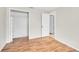 Spacious bedroom with hardwood floors and a large closet at 3766 E Easter S Cir, Centennial, CO 80122