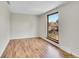 Bright bedroom with hardwood floors and a window view of the backyard at 3766 E Easter S Cir, Centennial, CO 80122