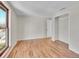 Bedroom featuring hardwood floors, a window, and closet space at 3766 E Easter S Cir, Centennial, CO 80122