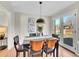 A dining room with hard wood floors and modern art work at 3766 E Easter S Cir, Centennial, CO 80122