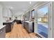 Modern kitchen with stainless steel range, tile backsplash, and access to the outdoor deck at 3766 E Easter S Cir, Centennial, CO 80122