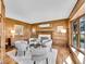 Elegant living room featuring wood paneled walls, a fireplace, and hardwood floors at 3766 E Easter S Cir, Centennial, CO 80122