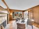 Bright living room featuring wood paneled walls and a fireplace at 3766 E Easter S Cir, Centennial, CO 80122