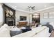 Inviting living room with fireplace, modern decor, and comfortable seating arrangement at 17890 Calendula Dr, Parker, CO 80134