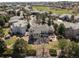 An aerial view of the house and surrounding area showcasing a golf course nearby at 21231 E Saddle Rock Ln, Aurora, CO 80016