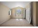 Bright bedroom featuring a large window, closet, and neutral colors, creating a comfortable and inviting space at 21231 E Saddle Rock Ln, Aurora, CO 80016