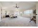 Spacious main bedroom with vaulted ceiling, ceiling fan, and balcony access at 21231 E Saddle Rock Ln, Aurora, CO 80016