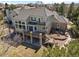 Multi-story home with an outdoor living area and beautiful stone accents at 21231 E Saddle Rock Ln, Aurora, CO 80016