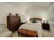 Bright bedroom with vaulted ceilings, woven headboard and comfortable furnishings for restful nights at 2378 Hearth Dr # 6, Evergreen, CO 80439